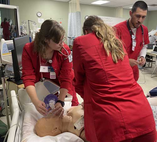 School of Nursing students testing their skills out on the simulator. 