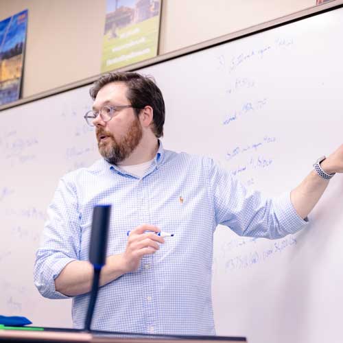 Prof. Josh McNall teaching students